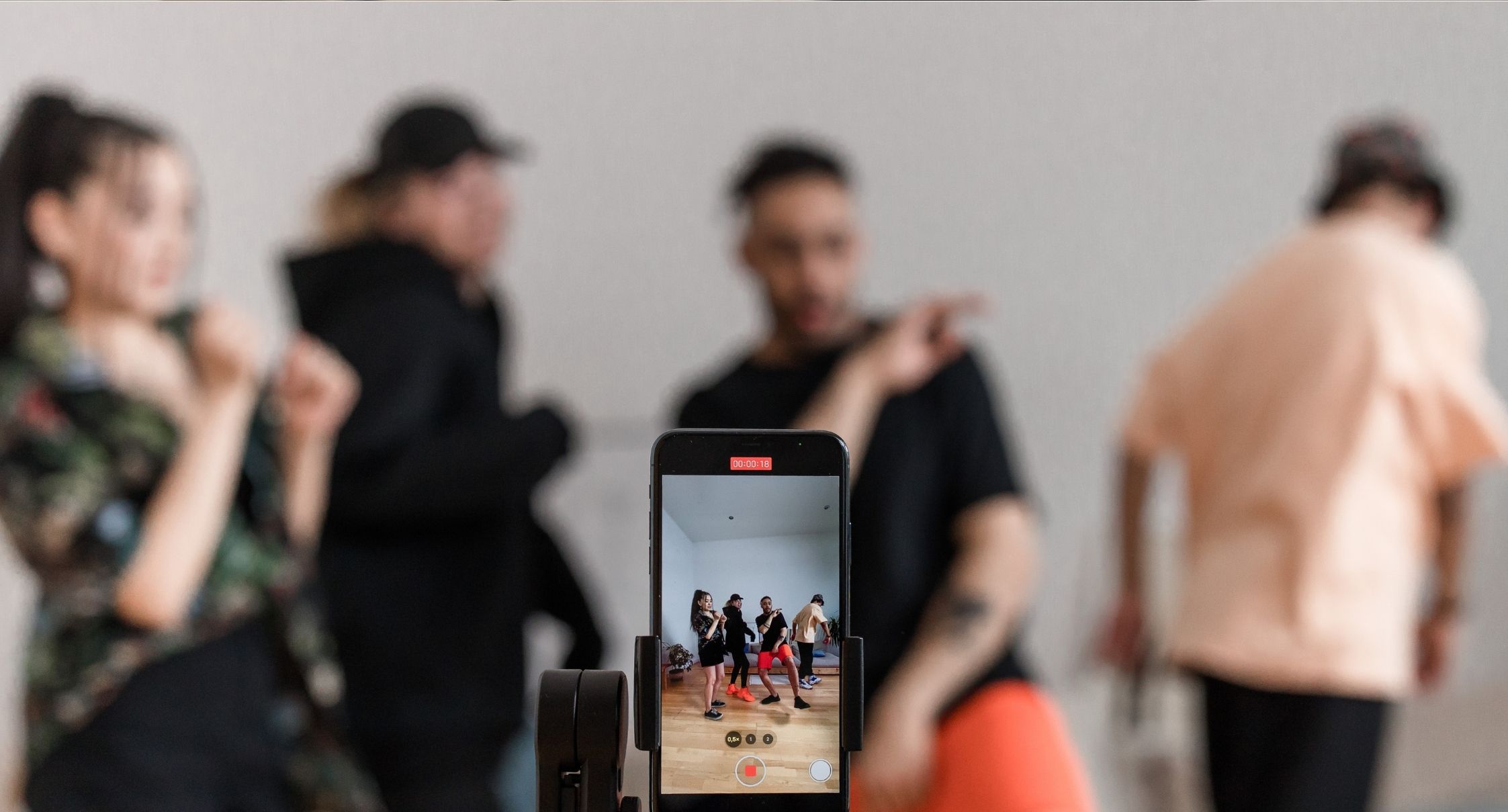 a group filming a tiktok dance